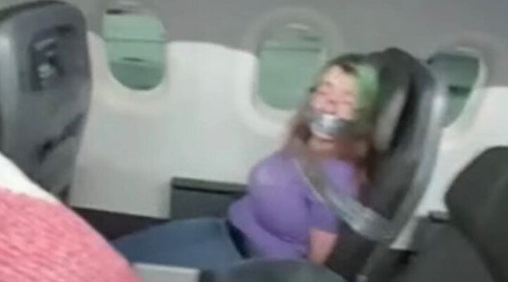 Uçaktaki görevliyi ısıran kadını koli bandı ile bağlamışlardı: Rekor para cezası